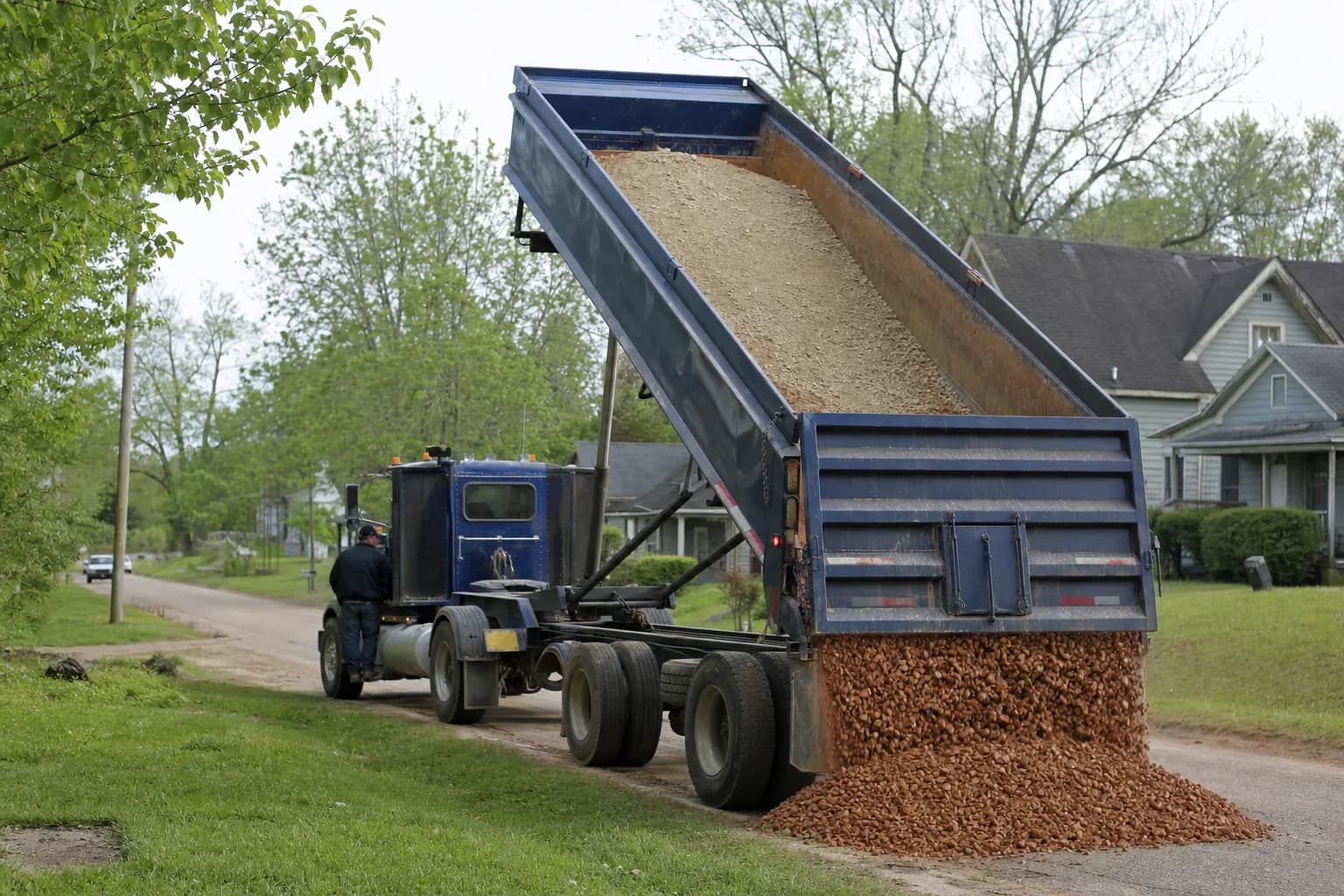 Dump truck delivering gravel